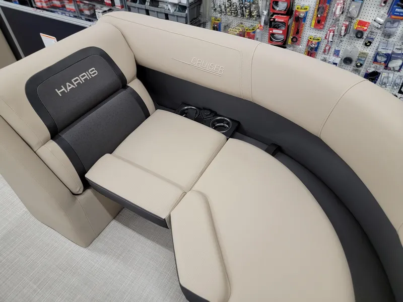 Slide: The Image of 2024 Harris Cruiser 210 boat interior seating with cup holders. - 9