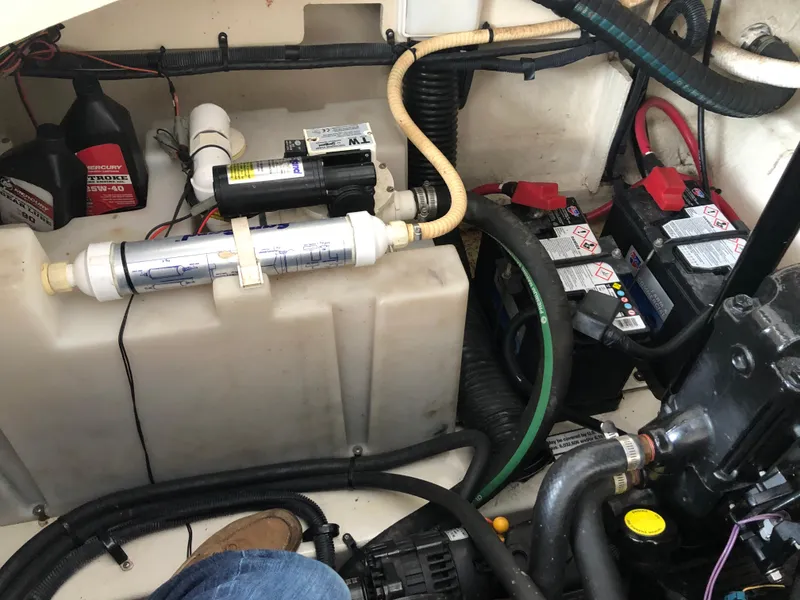 Slide: The Image of 2007 Sea Ray 260 Sundancer engine compartment with batteries and water filtration system. - 12