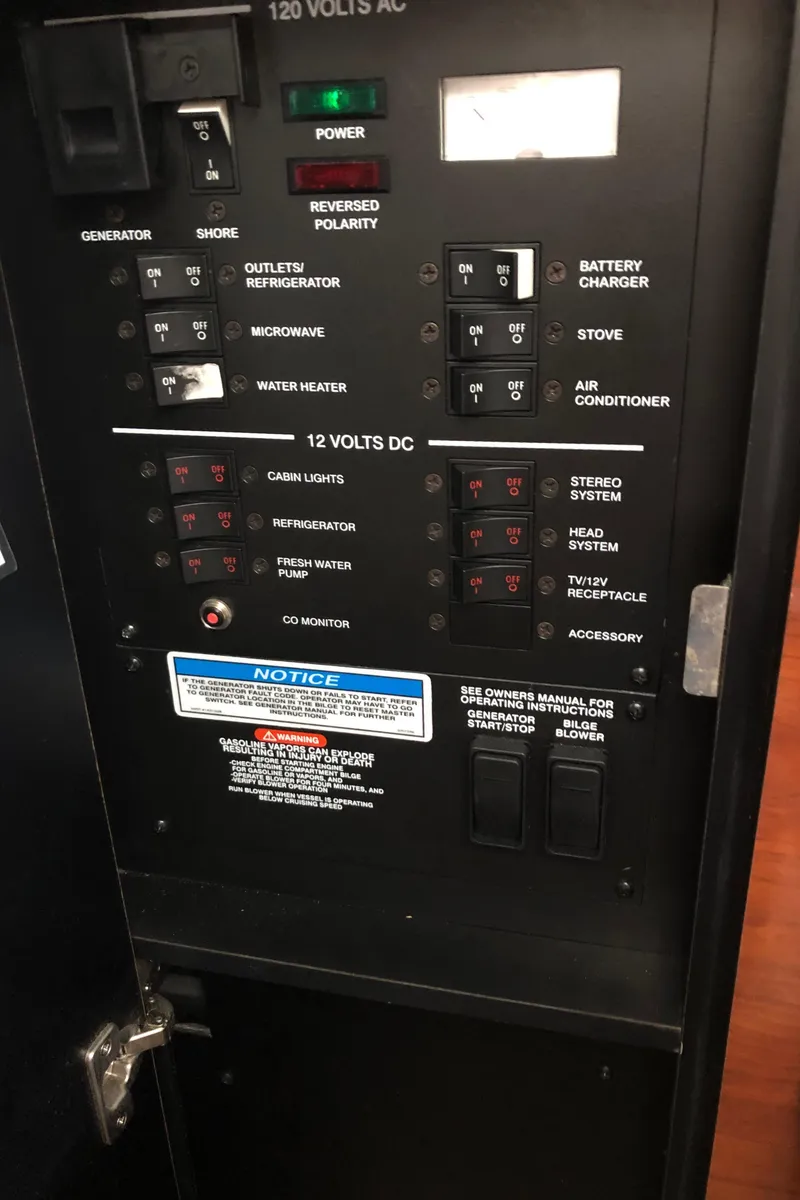 Slide: The Image of Electrical control panel of a 2007 Sea Ray 260 Sundancer boat. - 14