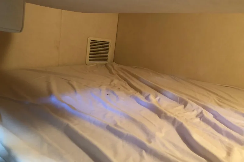 Slide: The Image of 2007 Sea Ray 260 Sundancer cabin bed with vent. - 24