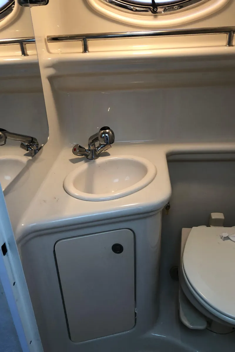 Slide: The Image of 2007 Sea Ray 260 Sundancer bathroom with sink and toilet. - 26