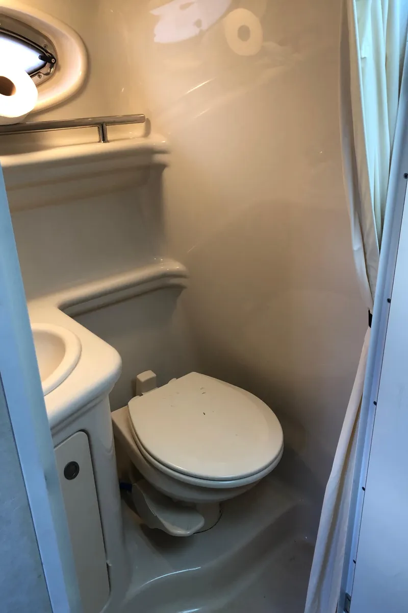 Slide: The Image of Compact bathroom in a 2007 Sea Ray 260 Sundancer boat. - 27