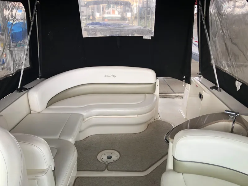 Slide: The Image of 2007 Sea Ray 260 Sundancer boat interior with white leather seating. - 3