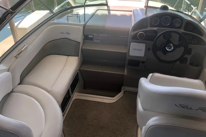 Slide: The Image of 2007 Sea Ray 260 Sundancer boat interior with helm and seating area. - 37