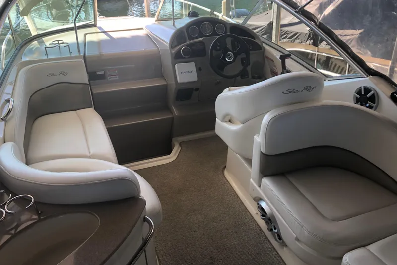 Slide: The Image of Interior of a 2007 Sea Ray 260 Sundancer boat with seating and helm. - 39