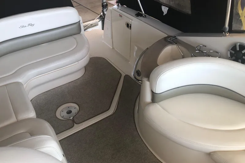 Slide: The Image of Interior of 2007 Sea Ray 260 Sundancer boat with white seating and carpeted floor. - 40