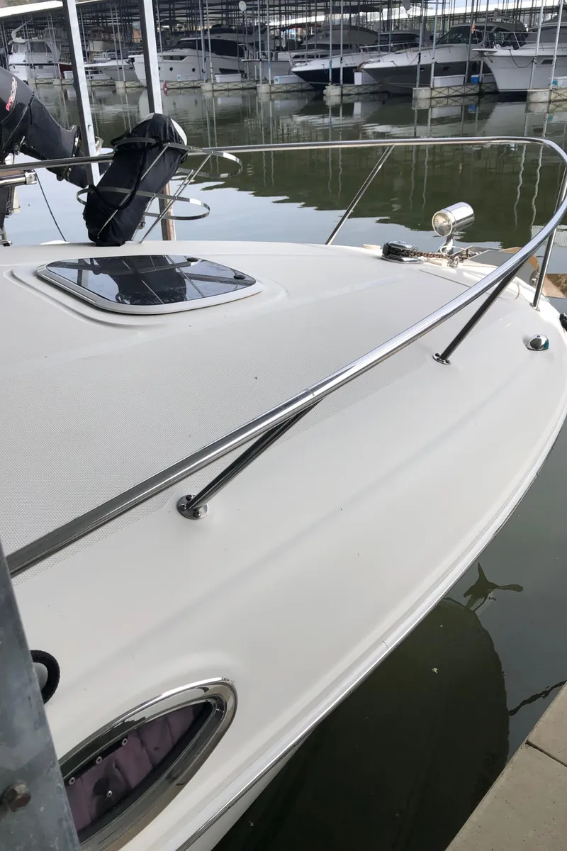 Slide: The Image of 2007 Sea Ray 260 Sundancer boat docked at a marina. - 5