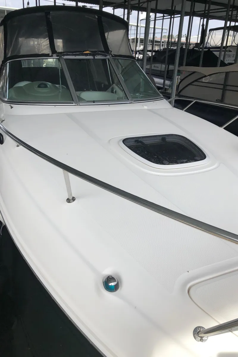 Slide: The Image of 2007 Sea Ray 260 Sundancer boat docked in marina. - 6