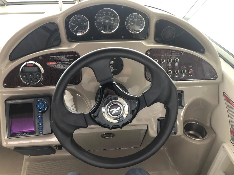 Slide: The Image of Steering console of a 2007 Sea Ray 260 Sundancer boat with navigation system. - 7