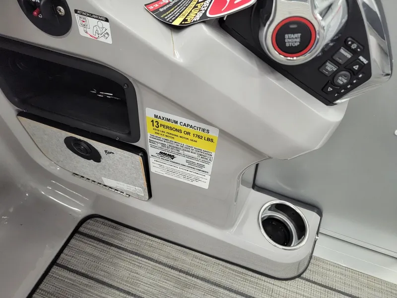 Slide: The Image of 2024 Harris Sunliner 210 boat console with capacity label and controls. - 13