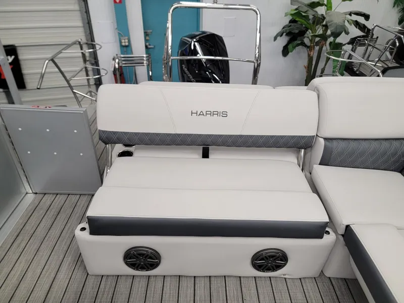 Slide: The Image of 2024 Harris Sunliner 210 boat interior with white and gray seating. - 14