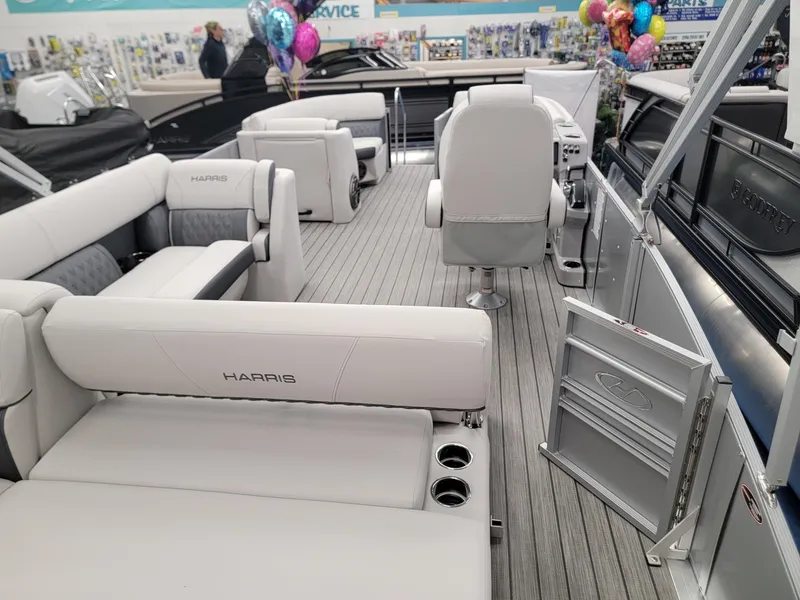 Slide: The Image of 2024 Harris Sunliner 210 pontoon boat interior with luxurious seating and modern design. - 19