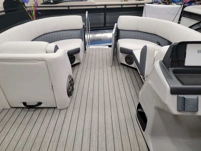 Slide: The Image of 2024 Harris Sunliner 210 pontoon boat interior with white seating and gray flooring. - 22