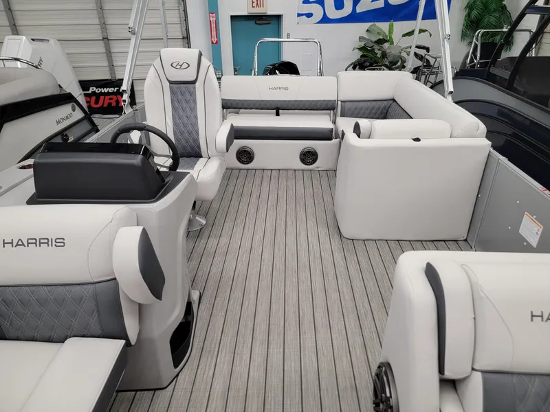Slide: The Image of 2024 Harris Sunliner 210 pontoon boat interior with luxurious seating and modern design. - 4