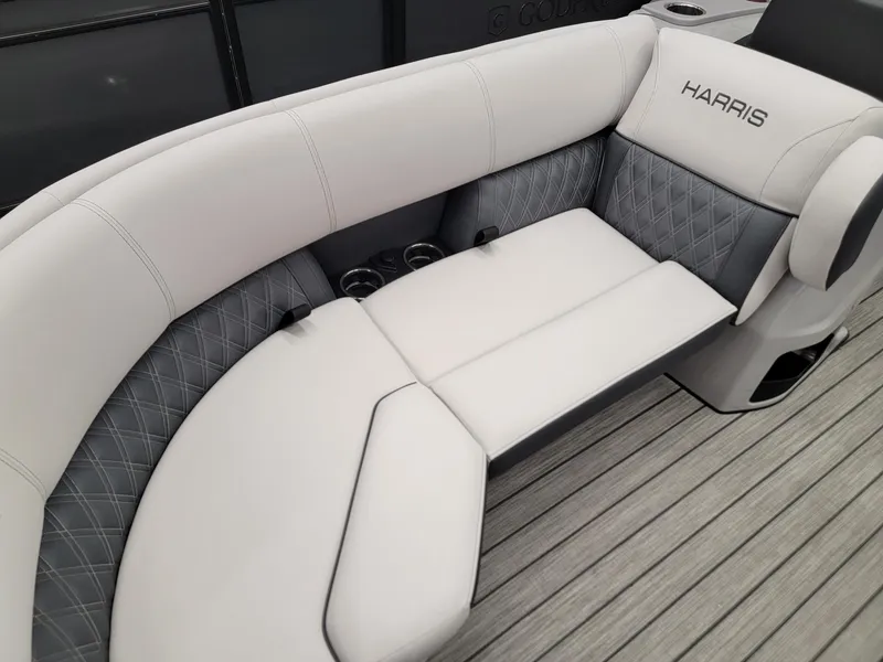 Slide: The Image of 2024 Harris Sunliner 210 boat interior with luxurious seating and cup holders. - 5