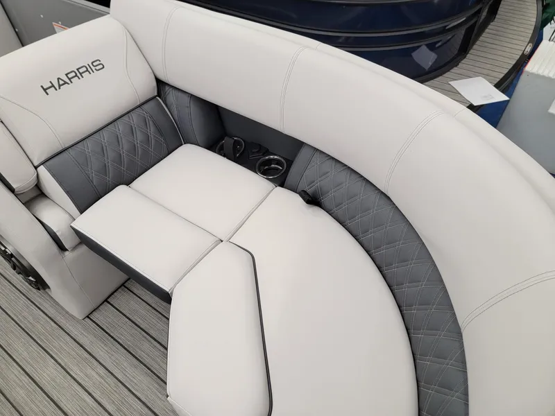 Slide: The Image of 2024 Harris Sunliner 210 boat interior with luxurious white and gray seating. - 6