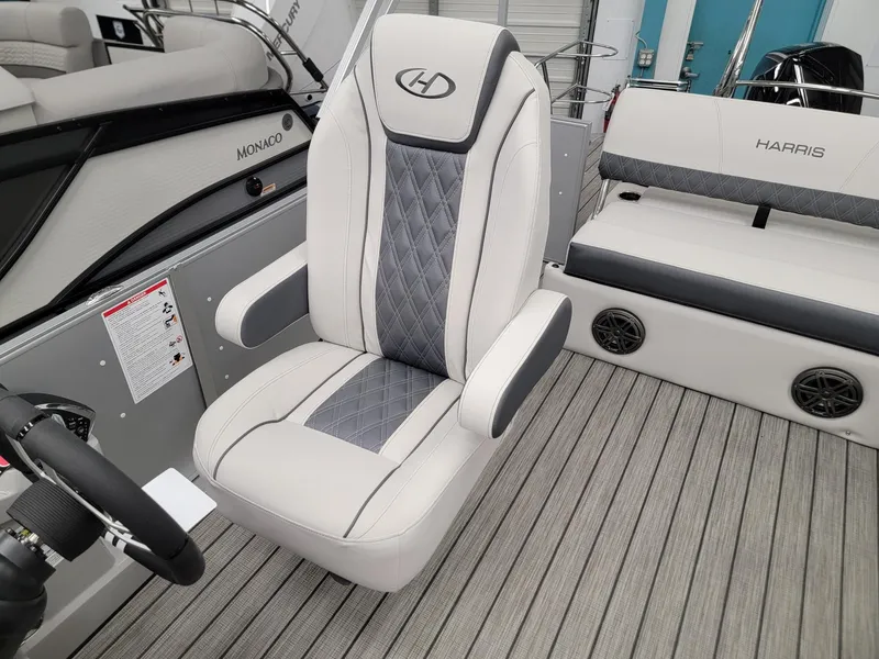 Slide: The Image of 2024 Harris Sunliner 210 boat interior with premium seating and modern design. - 8