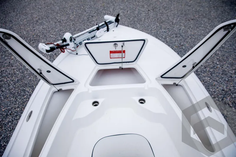 Slide: The Image of 2024 Tidewater 1910 Bay Max boat with open storage compartments. - 20