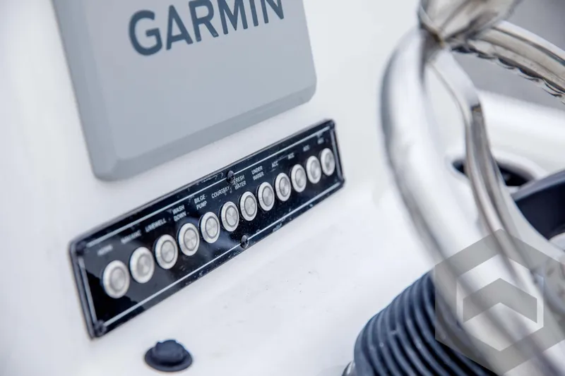 Slide: The Image of 2024 Tidewater 1910 Bay Max boat dashboard with Garmin navigation system. - 29