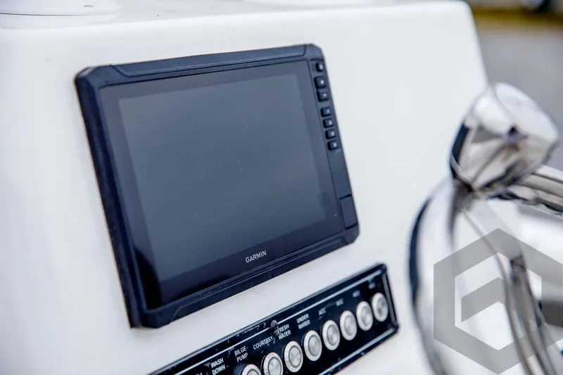Slide: The Image of Close-up of Garmin display on 2024 Tidewater 1910 Bay Max boat dashboard. - 30