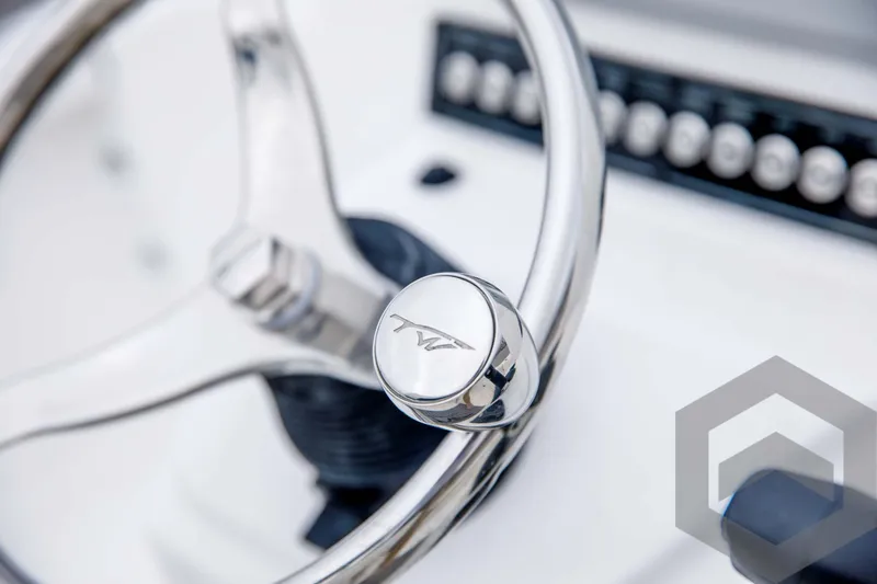 Slide: The Image of Close-up of 2024 Tidewater 1910 Bay Max boat steering wheel and dashboard. - 33