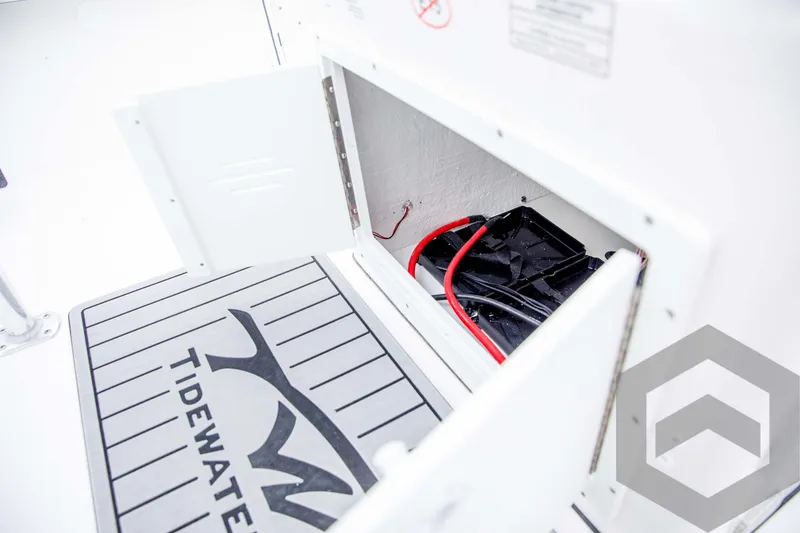 Slide: The Image of 2024 Tidewater 1910 Bay Max storage compartment with wiring and branded mat. - 36