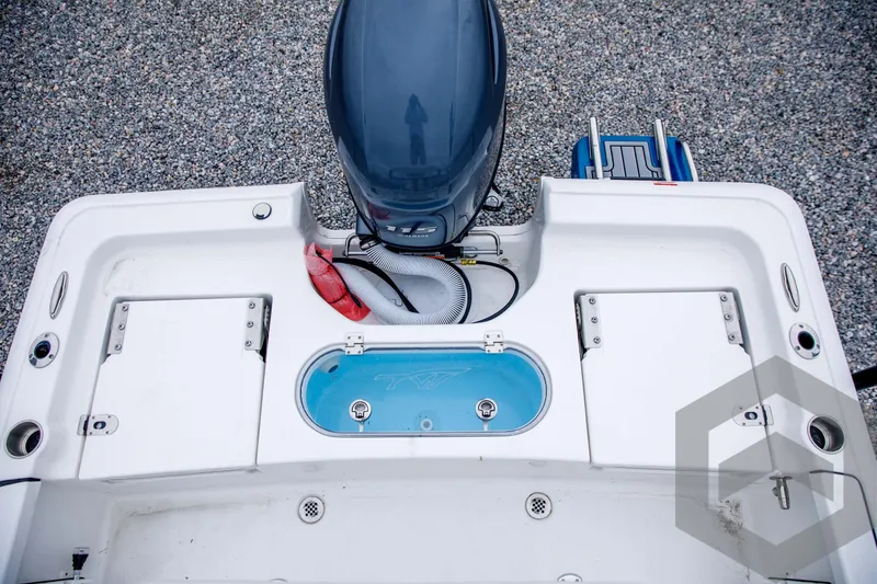 Slide: The Image of 2024 Tidewater 1910 Bay Max boat stern with motor and storage compartments. - 39