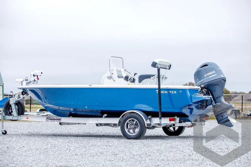 Slide: The Image of 2024 Tidewater 1910 Bay Max boat on trailer, blue hull, Yamaha outboard motor. - 7