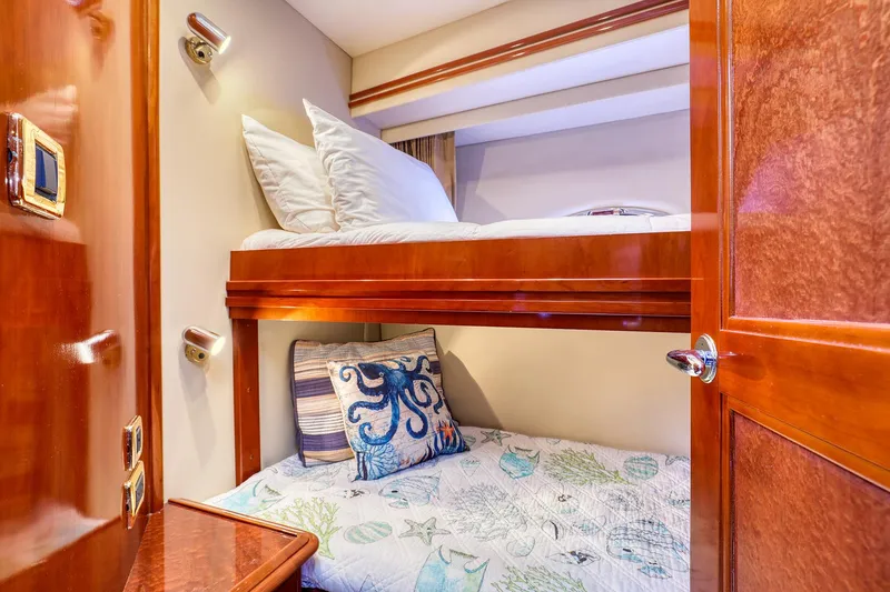 Slide: The Image of Bunk beds in 2005 Carver 560 Voyager yacht cabin with nautical-themed decor. - 11