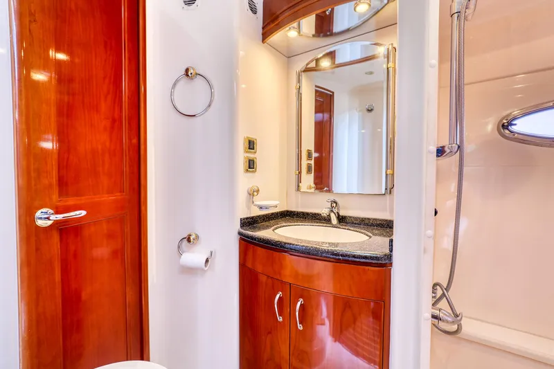 Slide: The Image of Luxurious bathroom in 2005 Carver 560 Voyager yacht with wood accents and modern fixtures. - 13