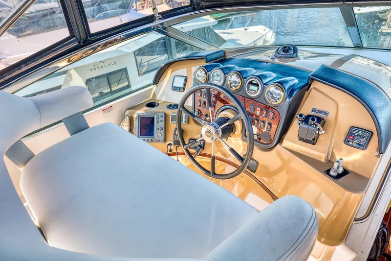 Slide: The Image of Helm of 2005 Carver 560 Voyager yacht with steering wheel and control panel. - 4