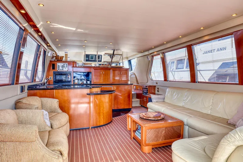 Slide: The Image of Luxurious interior of 2005 Carver 560 Voyager yacht with elegant seating and modern amenities. - 5