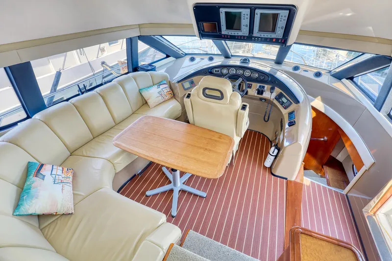 Slide: The Image of Luxurious 2005 Carver 560 Voyager yacht interior with leather seating and modern helm. - 8