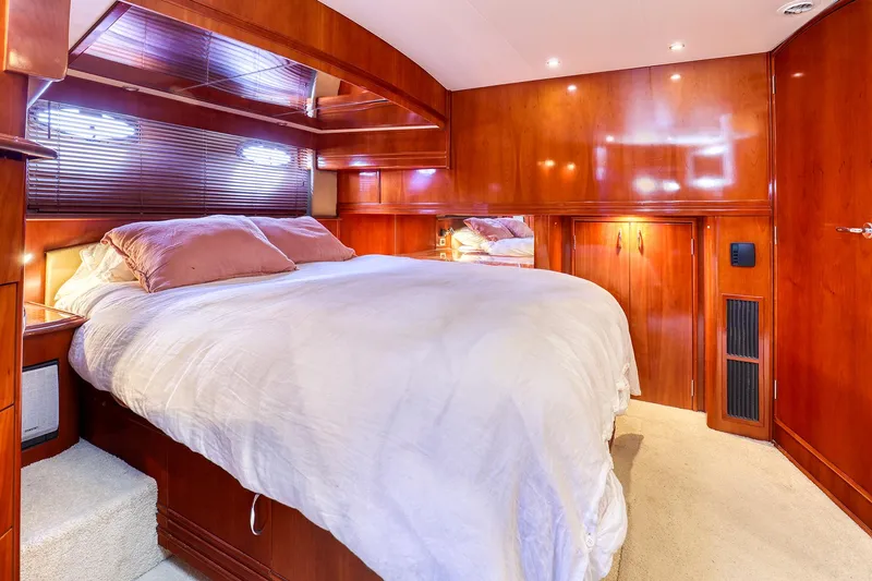 Slide: The Image of Luxurious bedroom interior of 2005 Carver 560 Voyager yacht with wooden finishes. - 9