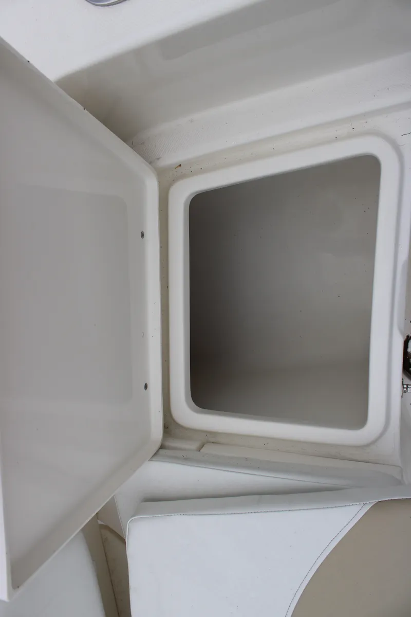 Slide: The Image of 2024 Bulls Bay 200 Center Console storage compartment. - 10