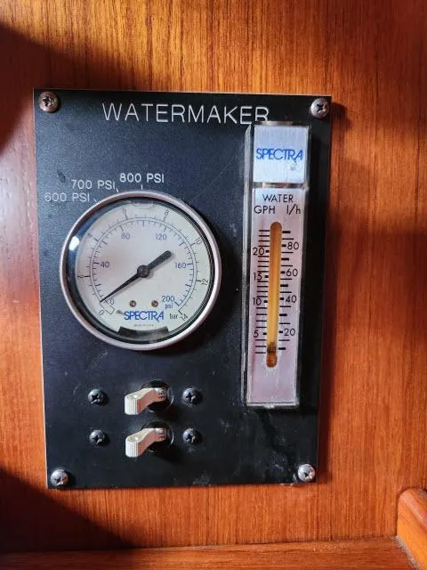 Slide: The Image of Nautor Swan 391 1984 watermaker control panel with pressure gauge and flow meter. - 19