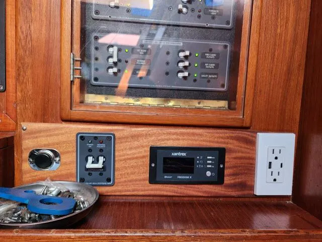 Slide: The Image of Control panel of a 1984 Nautor Swan 391 sailboat with electrical outlets and switches. - 21