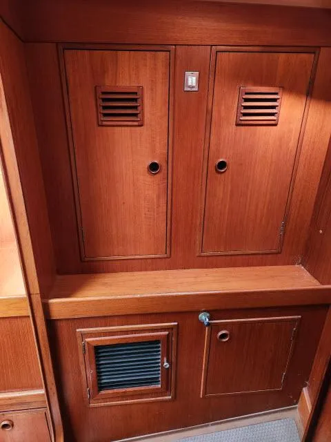 Slide: The Image of Wooden cabinetry inside a 1984 Nautor Swan 391 sailboat. - 25