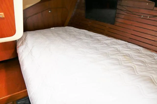 Slide: The Image of Cabin bed in 1984 Nautor Swan 391 sailboat with wooden interior. - 31