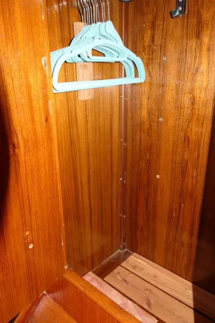 Slide: The Image of Wooden closet interior on a 1984 Nautor Swan 391 yacht with hangers. - 33