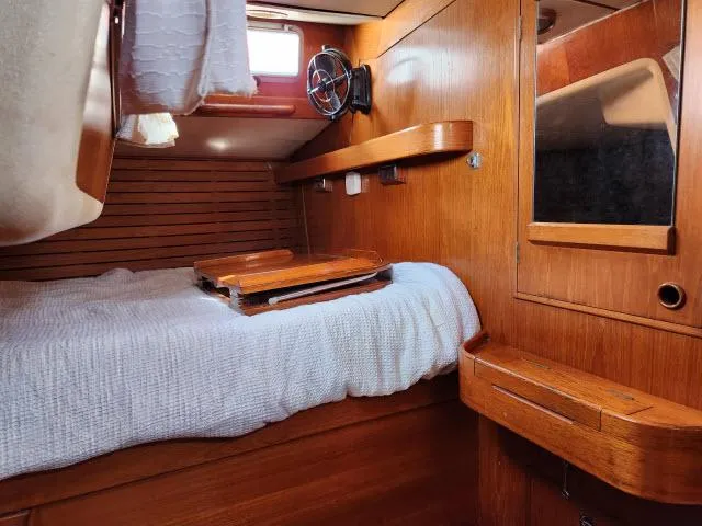 Slide: The Image of Cozy cabin interior of 1984 Nautor Swan 391 sailboat with wooden furnishings. - 34