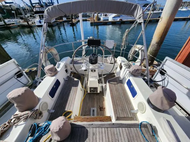 Slide: The Image of 1984 Nautor Swan 391 sailboat cockpit at marina. - 38