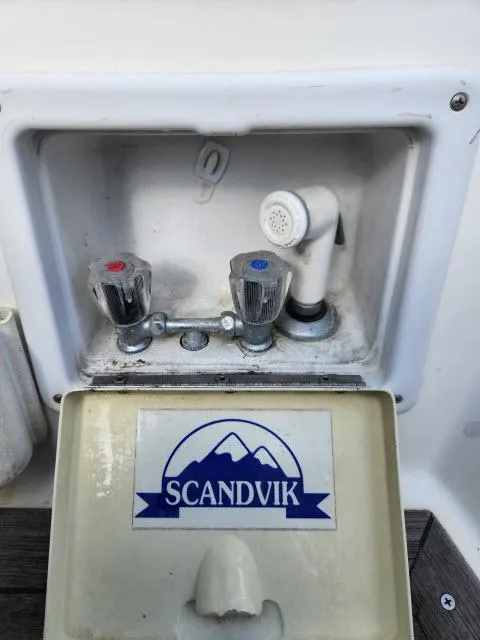 Slide: The Image of Nautor Swan 391 (1984) boat sink with Scandvik faucet and dual temperature controls. - 43