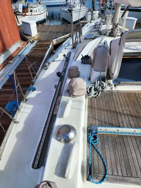 Slide: The Image of 1984 Nautor Swan 391 sailboat docked, showing deck and rigging details. - 45