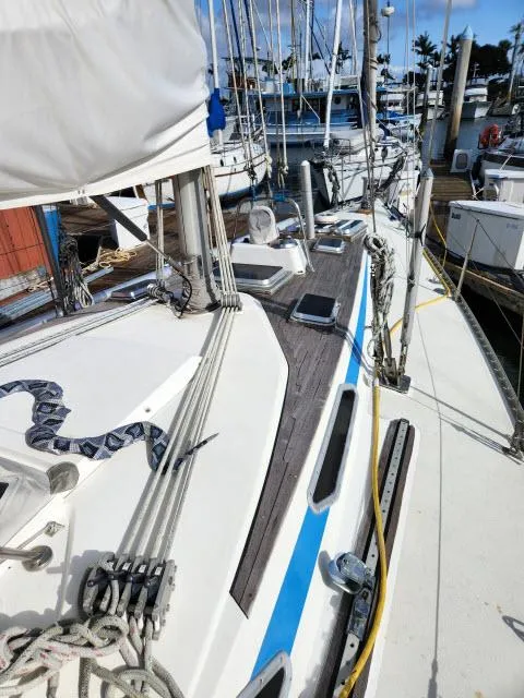 Slide: The Image of 1984 Nautor Swan 391 sailboat docked at a marina. - 47