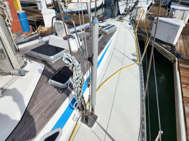 Slide: The Image of Nautor Swan 391 sailboat deck, 1984 model, docked at marina with rigging and equipment. - 48