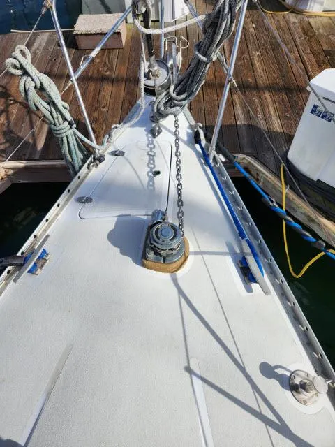Slide: The Image of Bow of 1984 Nautor Swan 391 sailboat with anchor chain and winch. - 49
