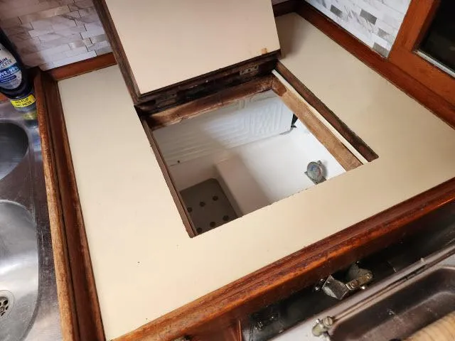 Slide: The Image of Open storage compartment in the galley of a 1984 Nautor Swan 391 sailboat. - 9