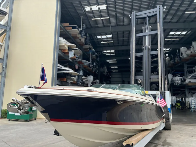 Slide: The Image of 2022 Chris-Craft Launch 27 boat in storage facility. - 12