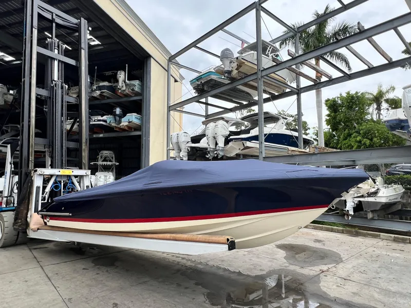 Slide: The Image of 2022 Chris-Craft Launch 27 boat in storage facility with cover. - 15